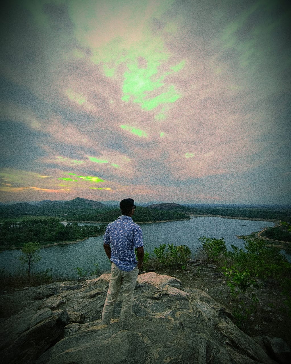 Suman overlooking hills and lake