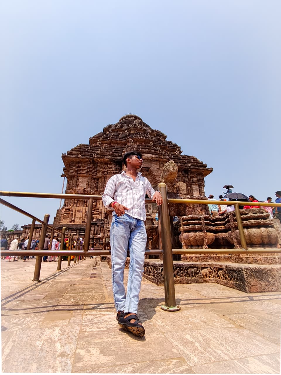 Suman standing near temple architecture